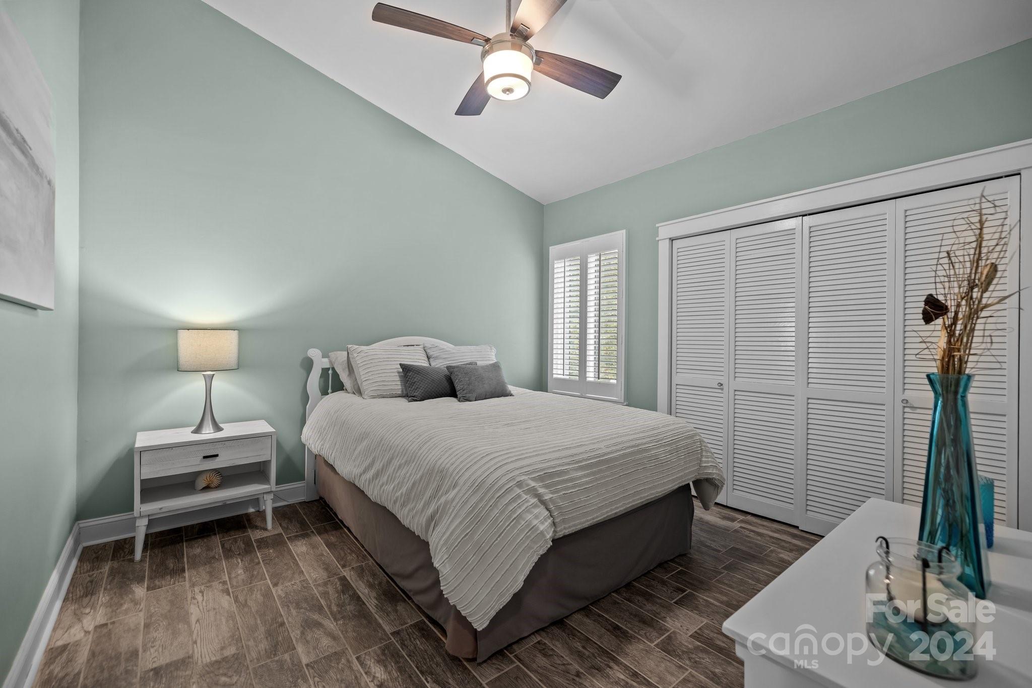 55 Ridgeport Road Lake Wylie, SC 29710 - Photo 28 of 45 a bedroom with a bed and a chandelier