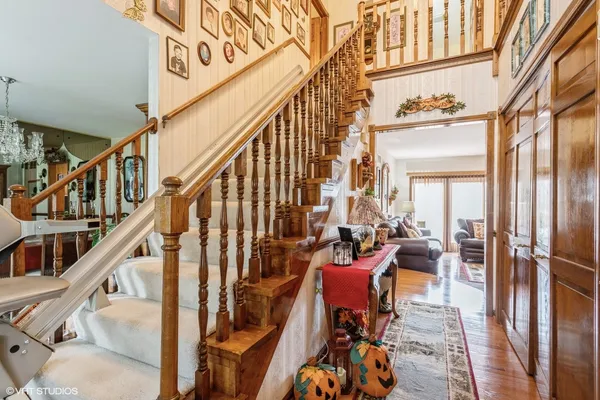 a view of a living room with furniture and floor to ceiling windows