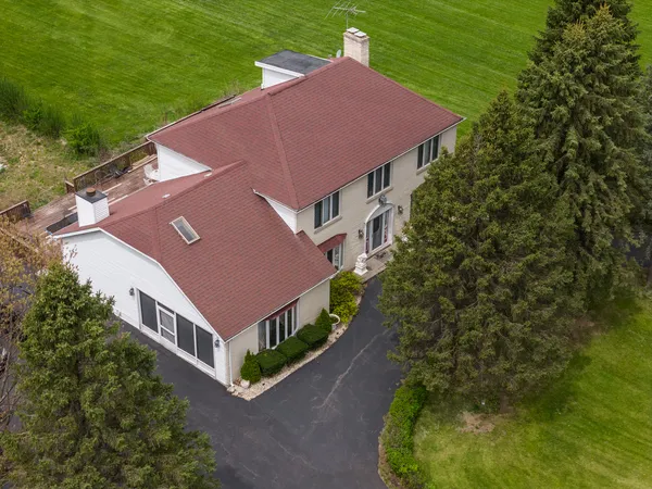 a aerial view of a house with a yard