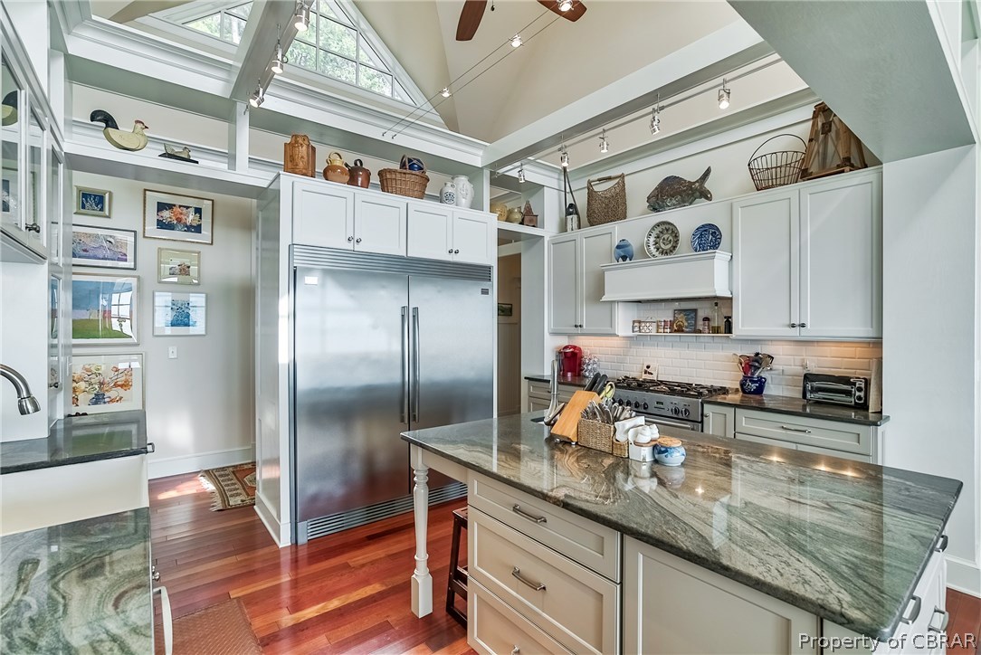 904 Queenstown Road Lancaster, VA 22503 - Photo 16 of 40 Kitchen: 13 x 15 with 4 x 6 island containing a prep sink & microwave. 60? stainless steel Frigidaire Professional refrigerator/freezer, 6-burner AGA range with custom hood, Kitchen Aid dishwasher.