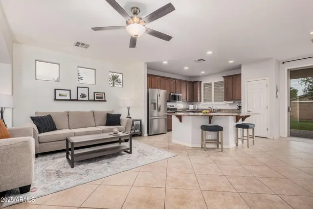 a open kitchen with cabinets and stainless steel appliances