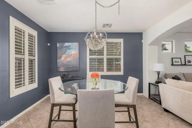 a dining room with furniture and window