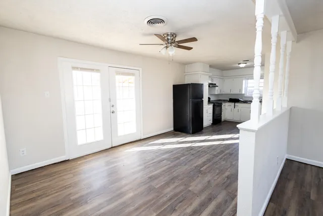 a view of a kitchen with a stove cabinets and wooden floor