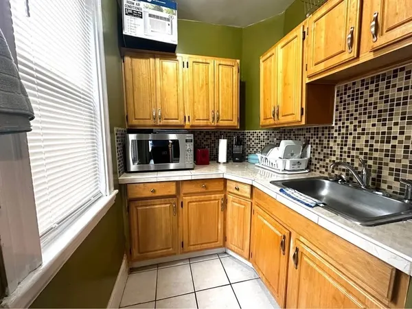 a kitchen with a sink and a window