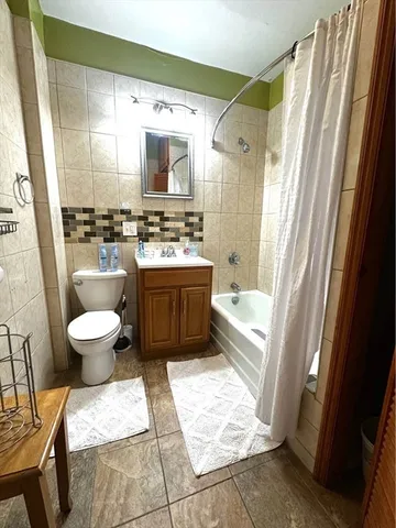 a bathroom with a bathtub sink and toilet