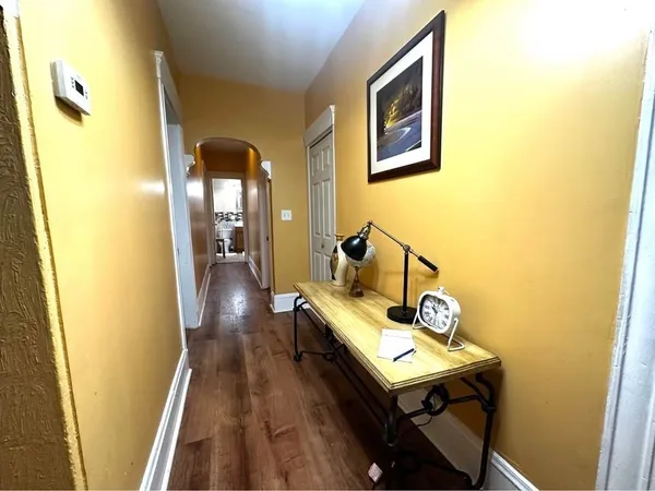 a view of a hallway with seating area