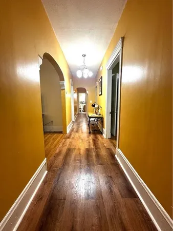 a view of a living room with wooden floor