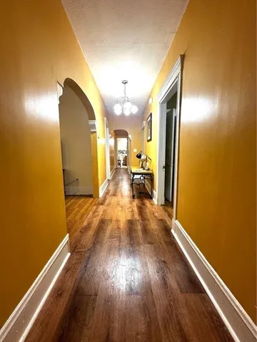 a view of a living room with wooden floor