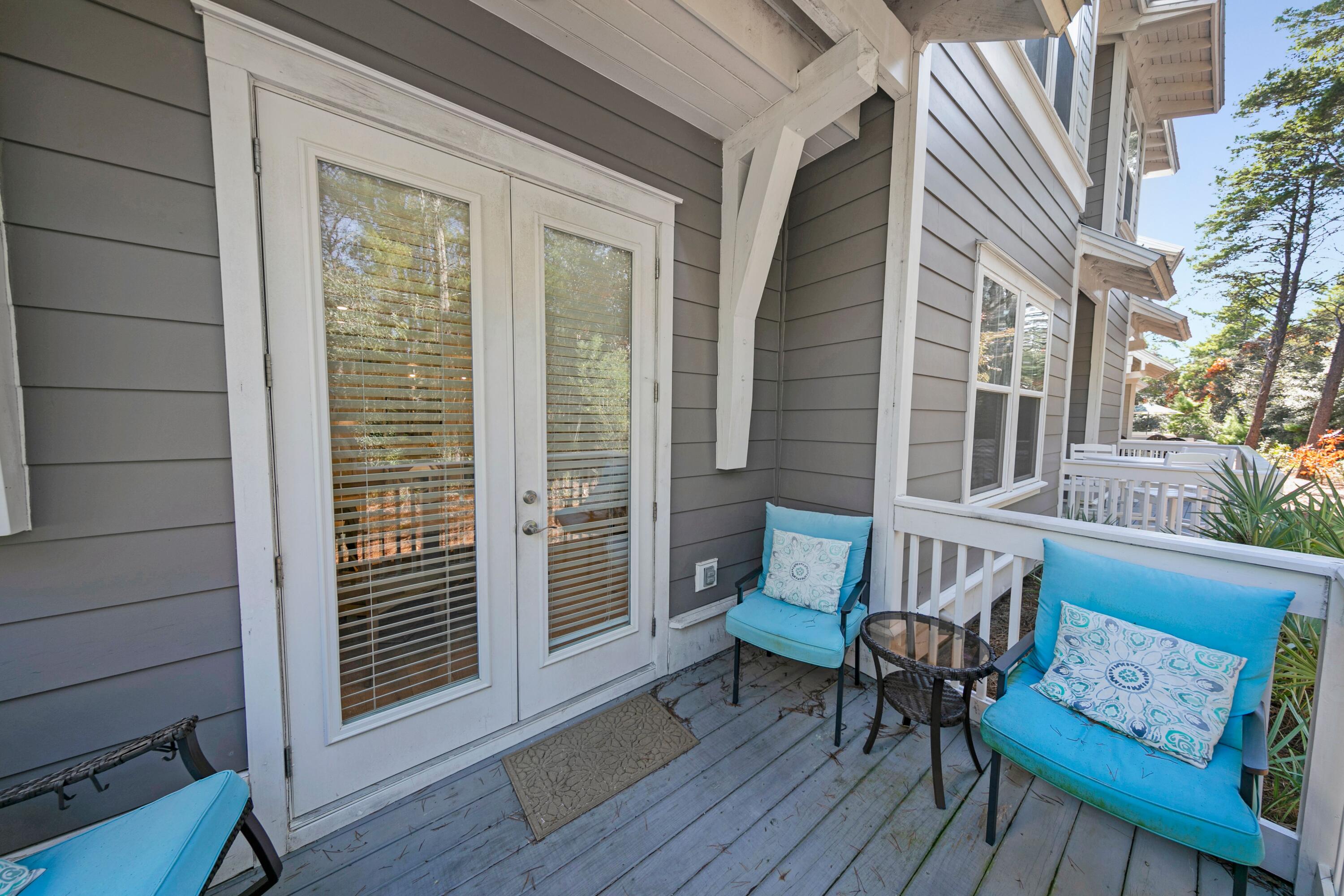 209 Milestone Dr Inlet Beach, Unit B Inlet Beach, FL 32461 - Photo 27 of 39 Double doors to enclosed patio