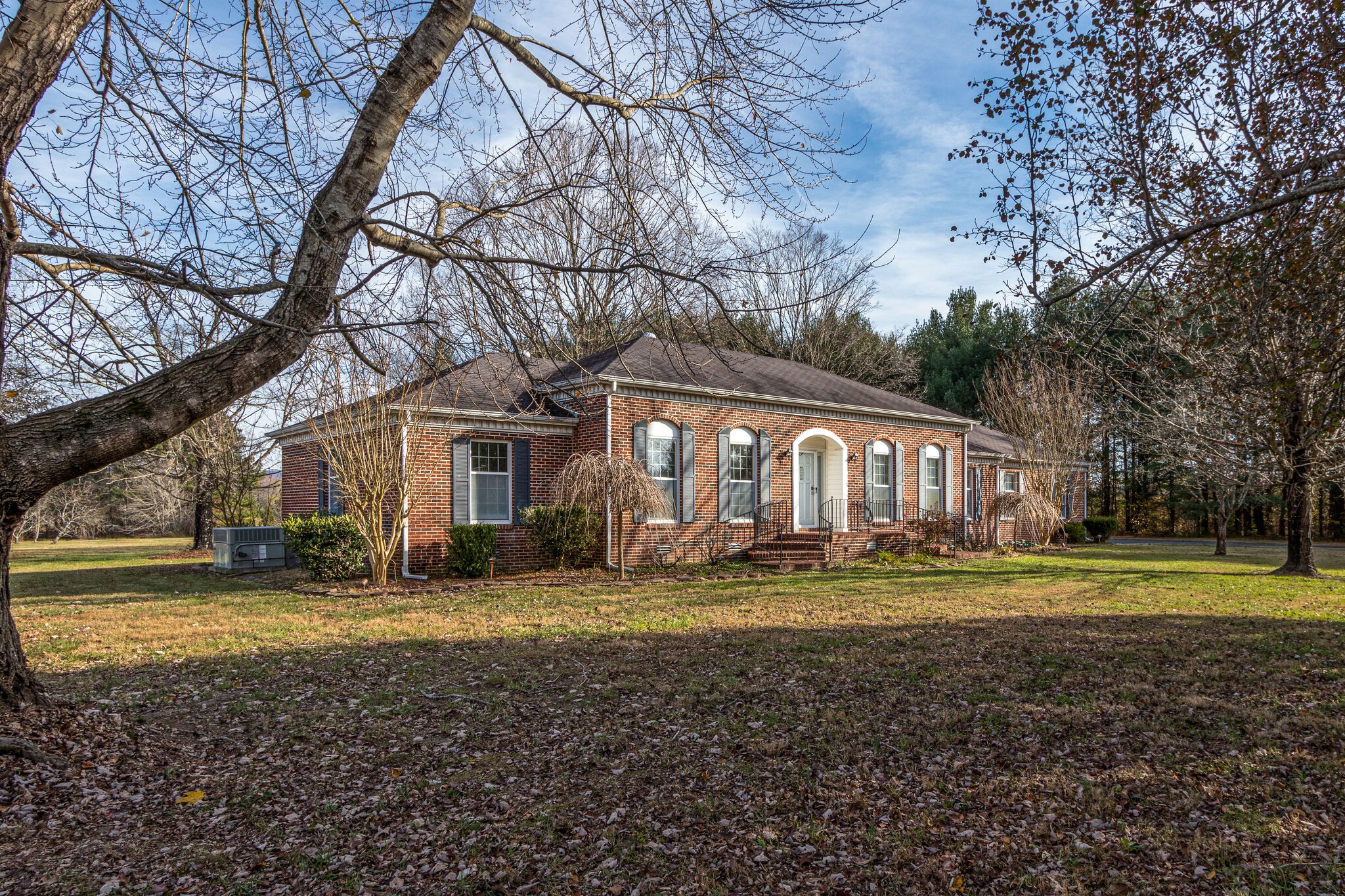 3083 Hickerson Road Manchester, TN 37355 - Photo 2 of 34 a view of a big house with big yard and large trees