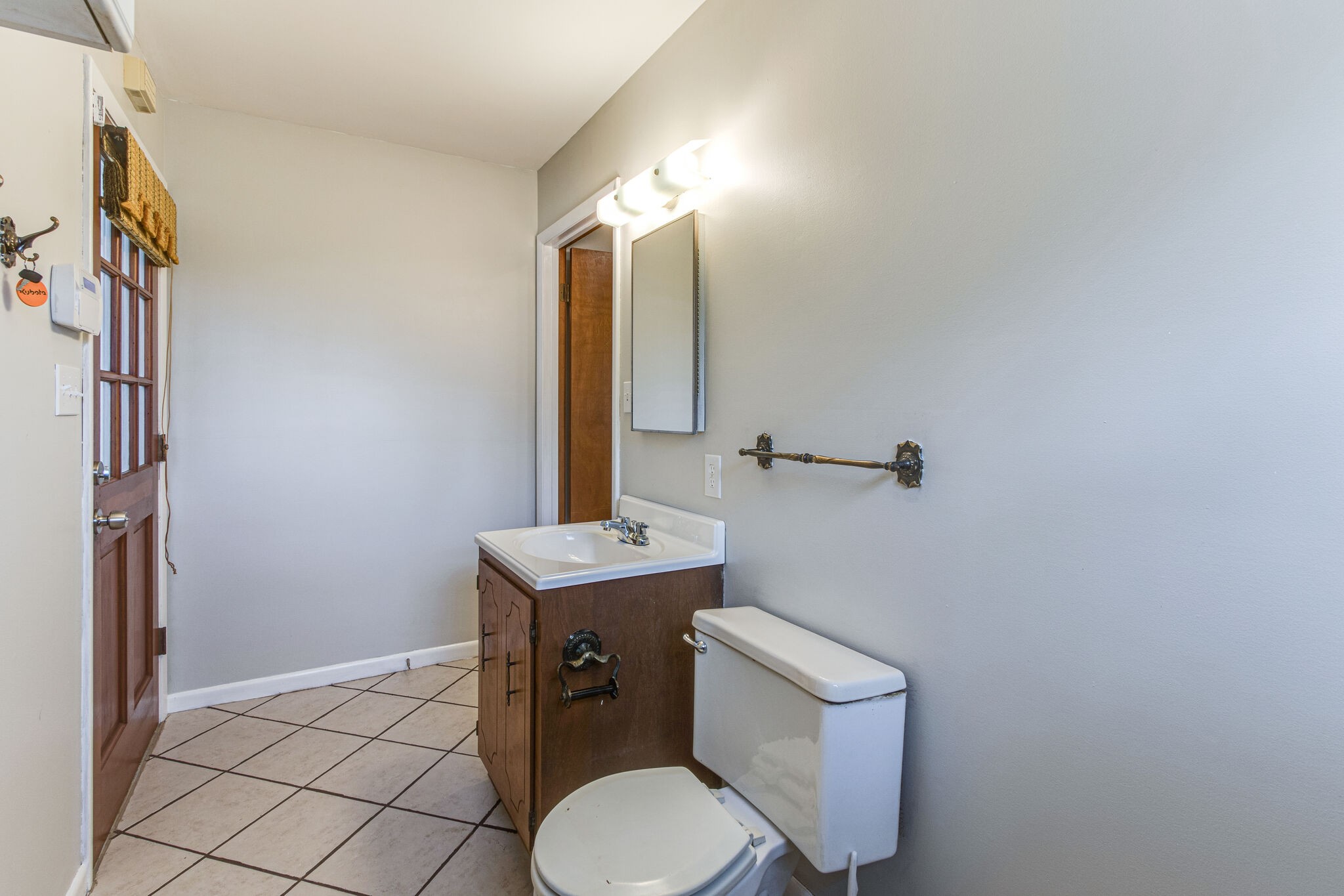 3083 Hickerson Road Manchester, TN 37355 - Photo 11 of 34 a bathroom with a toilet a sink and mirror