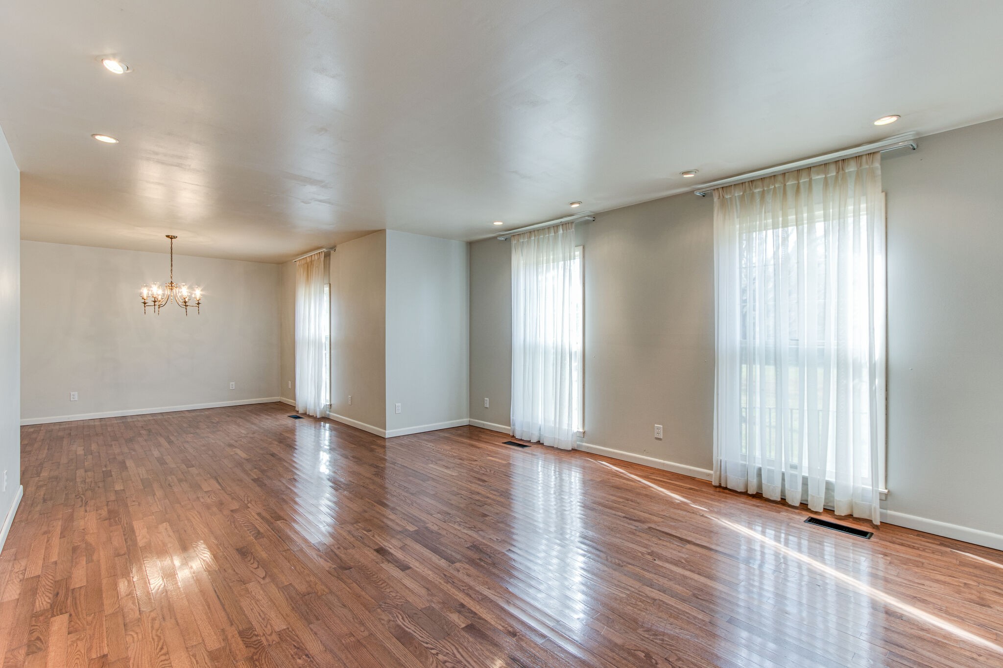 3083 Hickerson Road Manchester, TN 37355 - Photo 8 of 34 a view of an empty room with wooden floor and a window