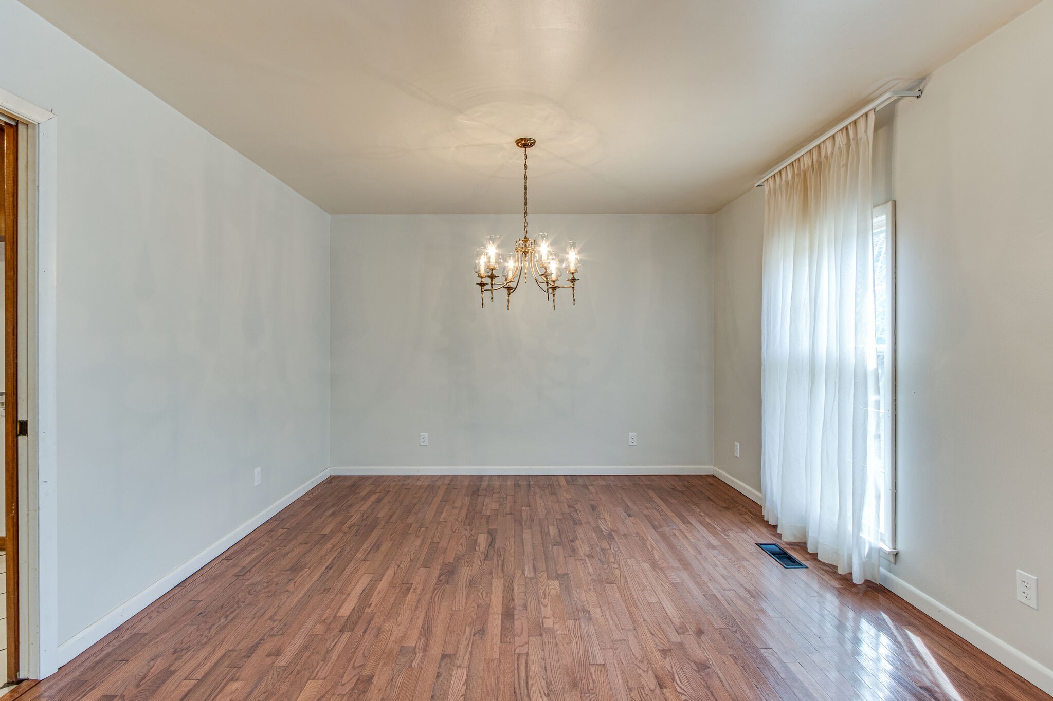 3083 Hickerson Road Manchester, TN 37355 - Photo 9 of 34 a view of a room with wooden floor chandelier and a window