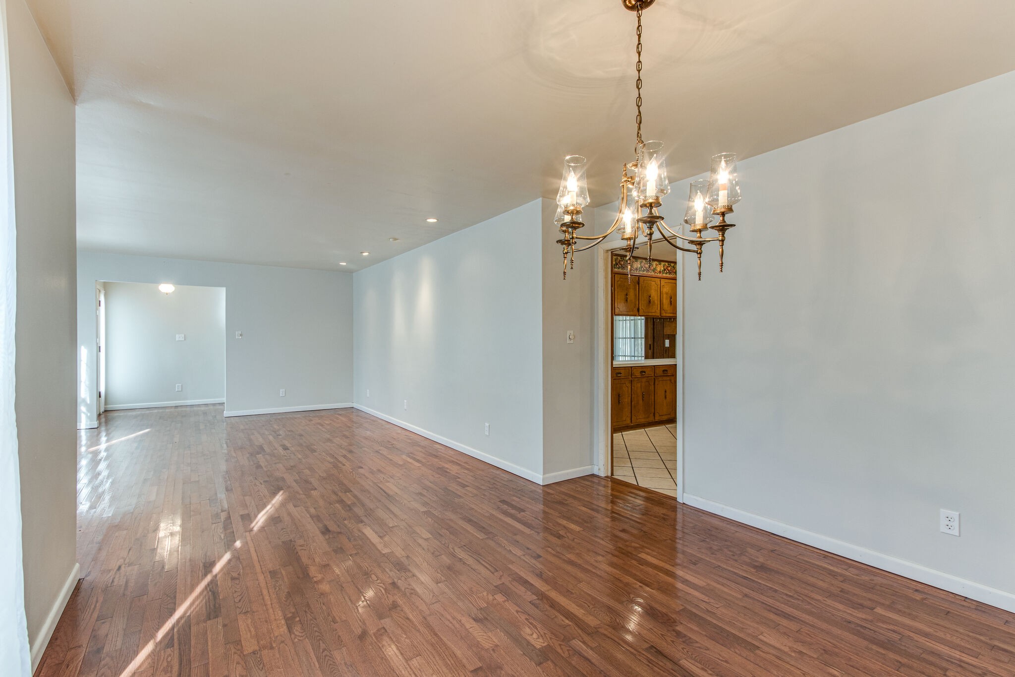 3083 Hickerson Road Manchester, TN 37355 - Photo 10 of 34 a view of a chandelier and wooden floor in a room