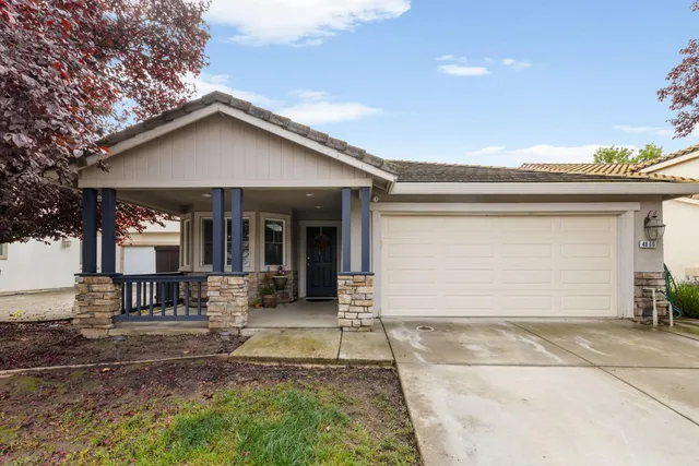 a front view of house with yard and seating space