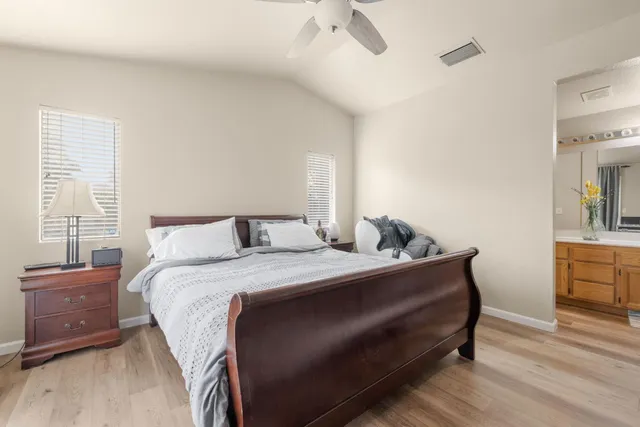 a bed room with a bed and a dresser