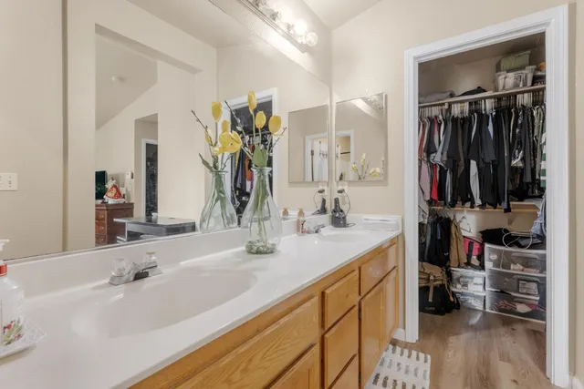 a bathroom with a sink double vanity and a mirror
