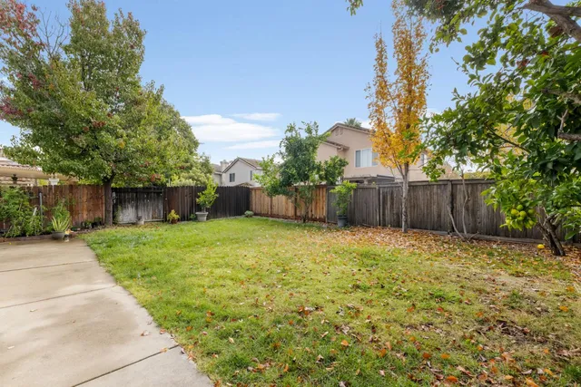 a backyard of a house with lots of green space