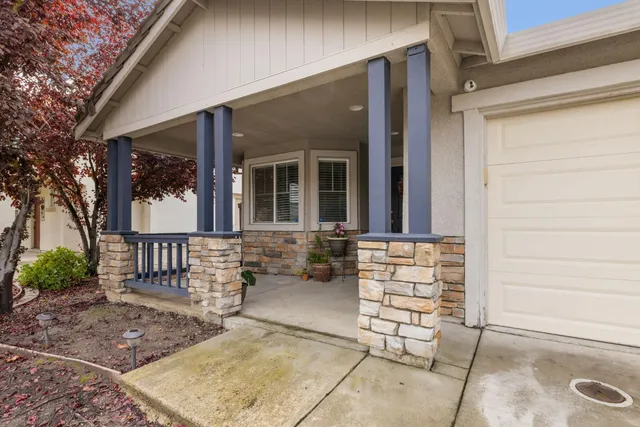 front view of a house with outdoor seating