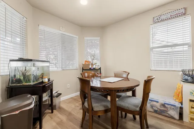 a view of a dining room with furniture and window