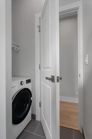 a view of a hallway with washer and dryer