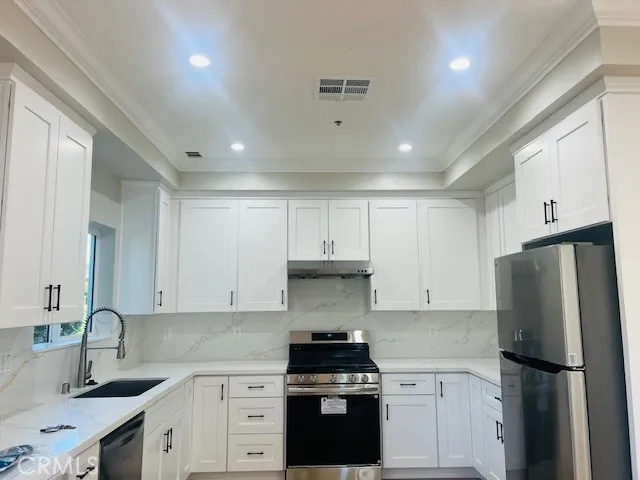 a bathroom with a shower a toilet and a sink