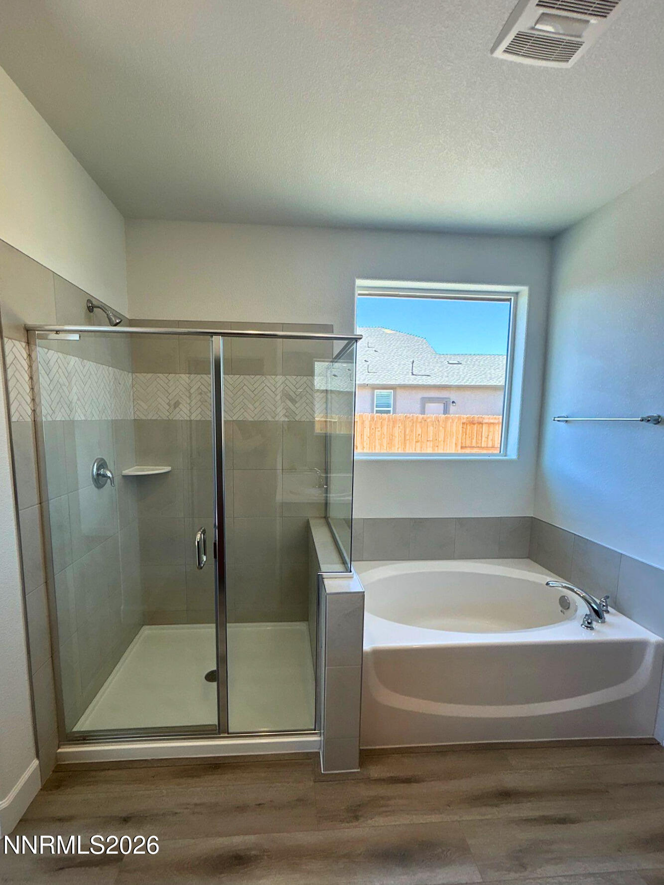 3453 Payton Way Fernley, NV 89408 - Photo 10 of 15 a bathroom with a bathtub and a shower