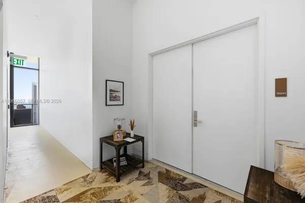 a living room with furniture and flowers