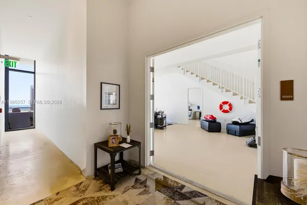 a kitchen with kitchen island a counter top space cabinets stainless steel appliances and a counter space