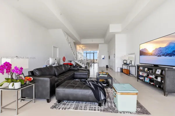 a bedroom with a bed and a night stand