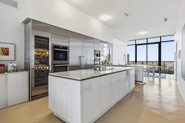 a bedroom with a bed and cabinets