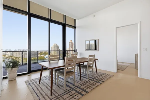 a room with a bed and a mirror