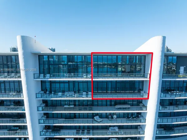 a view of water with tall building