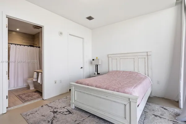 a room with furniture and pool table