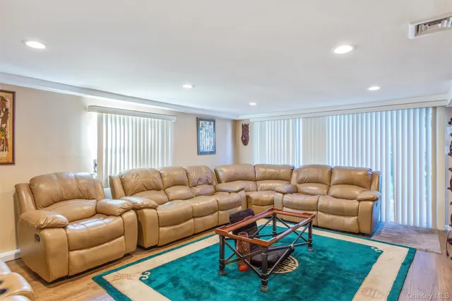 a living room with furniture and a rug