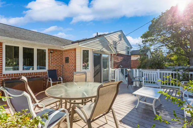 a view of a chairs and table in patio