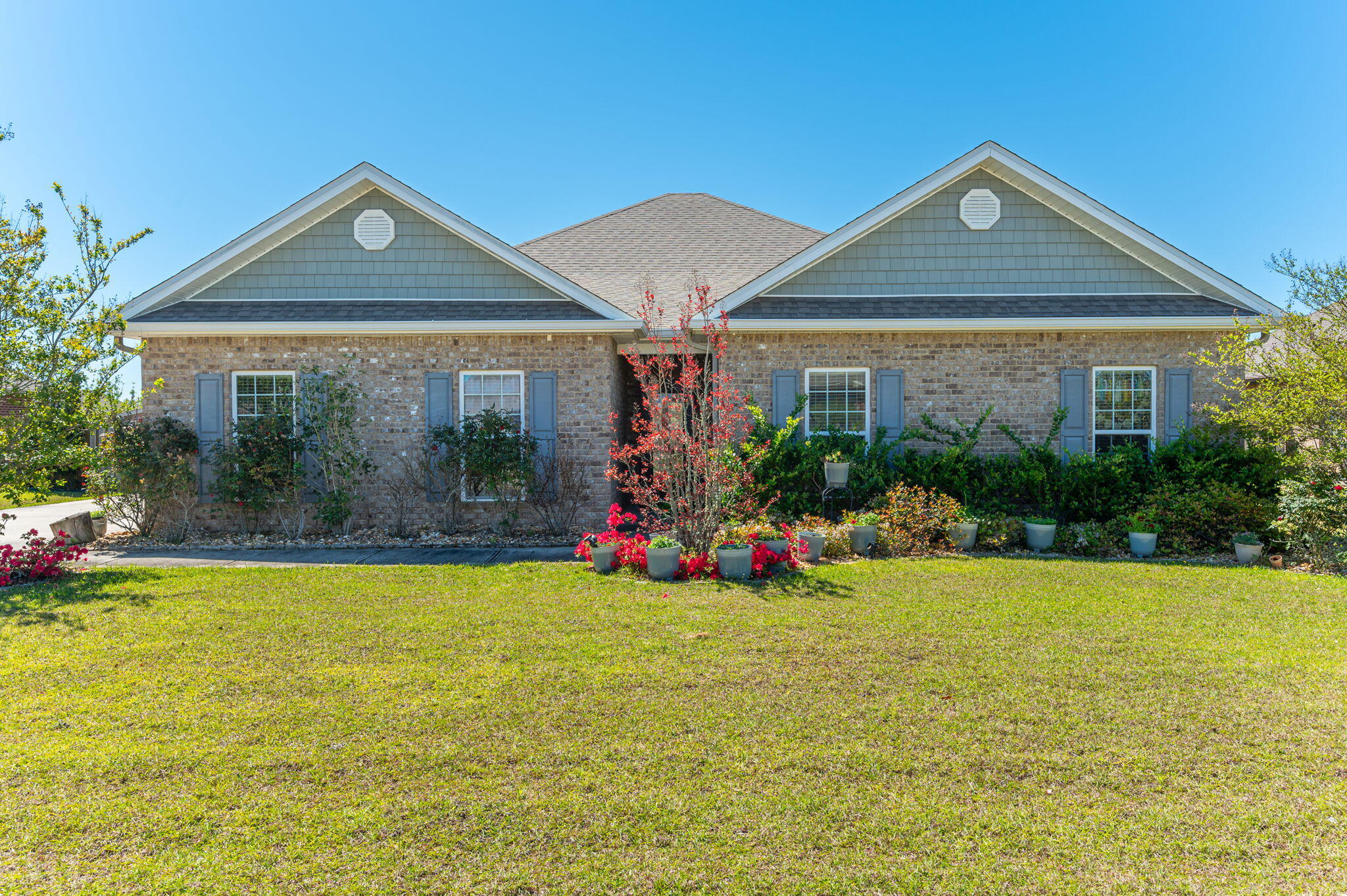 523 Gadwell Street Crestview, FL 32539 - Photo 1 of 30 a view of a house with swimming pool and garden