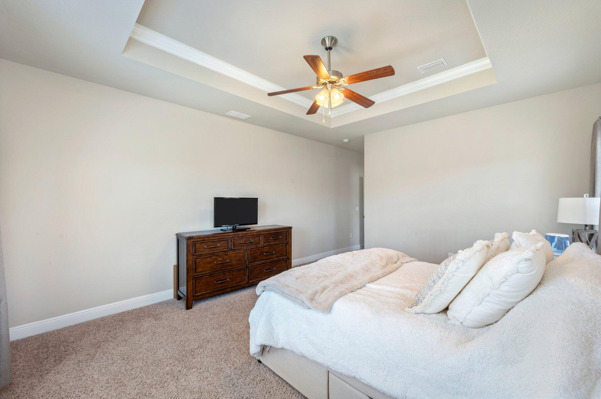 523 Gadwell Street Crestview, FL 32539 - Photo 13 of 30 a bedroom with a bed and ceiling fan