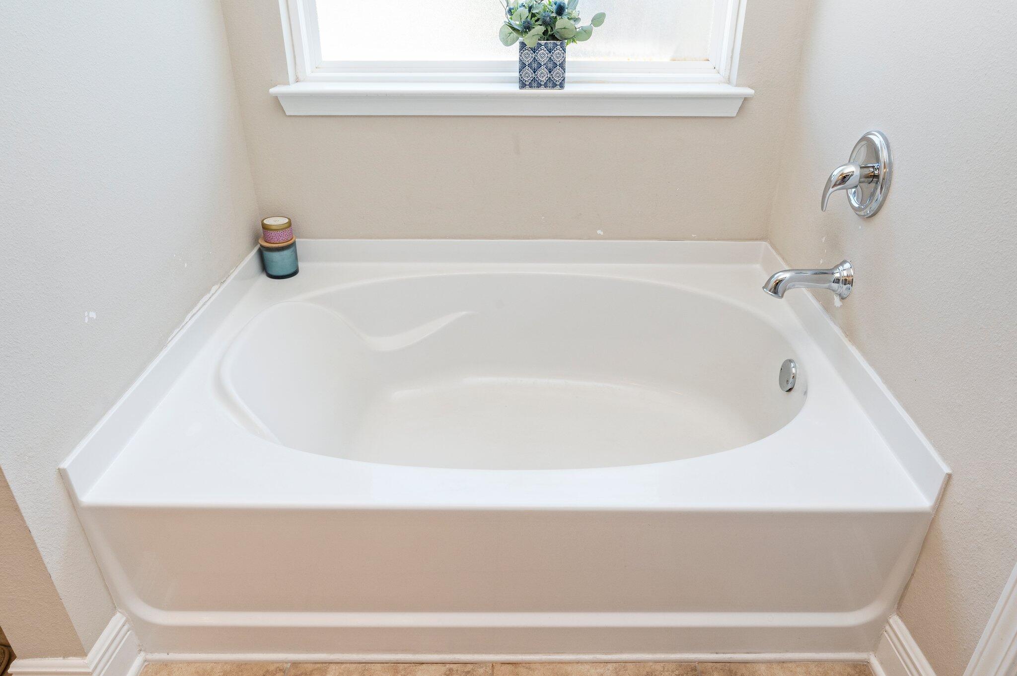 523 Gadwell Street Crestview, FL 32539 - Photo 16 of 30 a white bath tub sitting in a bathroom