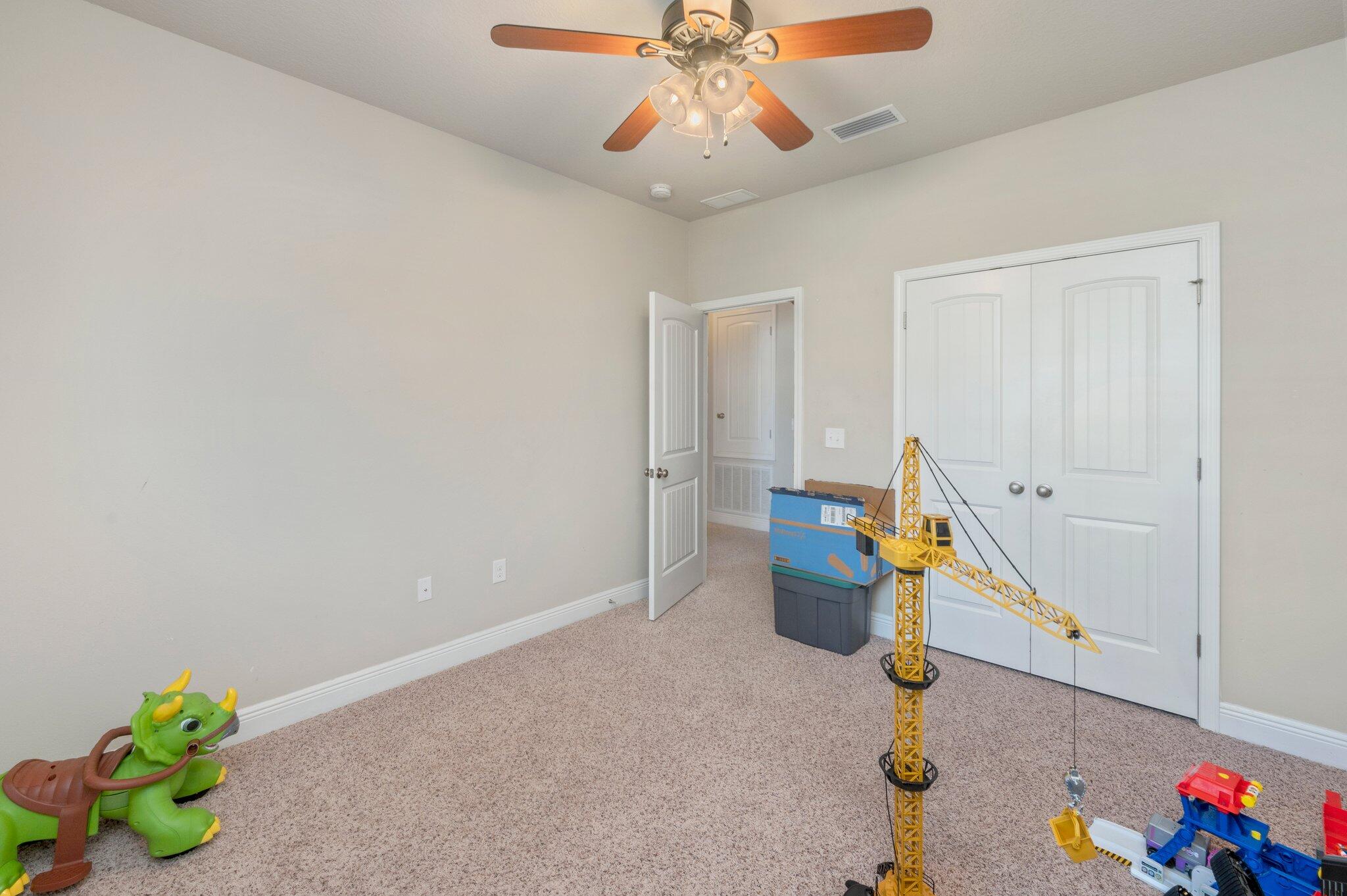 523 Gadwell Street Crestview, FL 32539 - Photo 19 of 30 a view of a room with toys and wooden floor