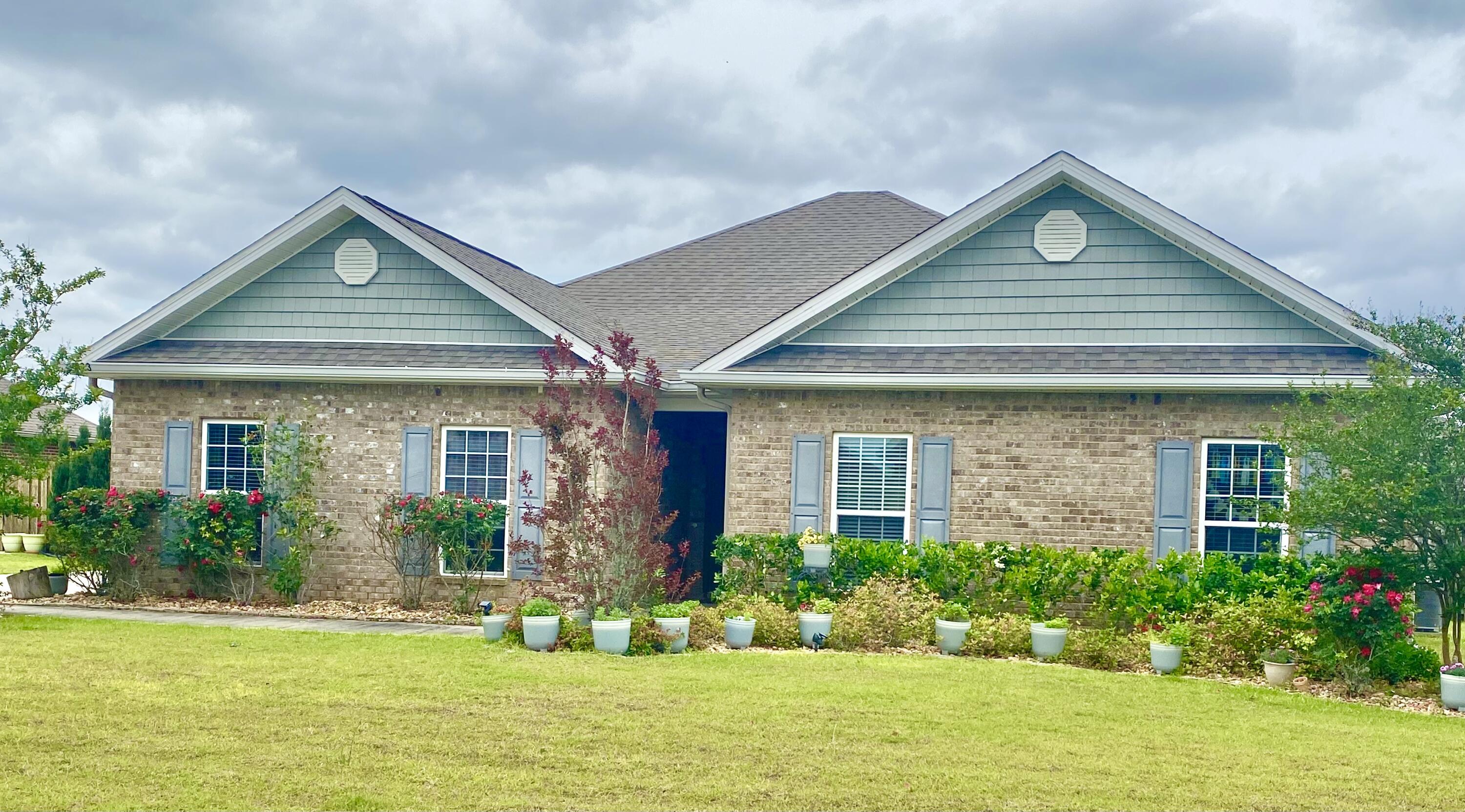 523 Gadwell Street Crestview, FL 32539 - Photo 2 of 30 a front view of a house with a yard and trees
