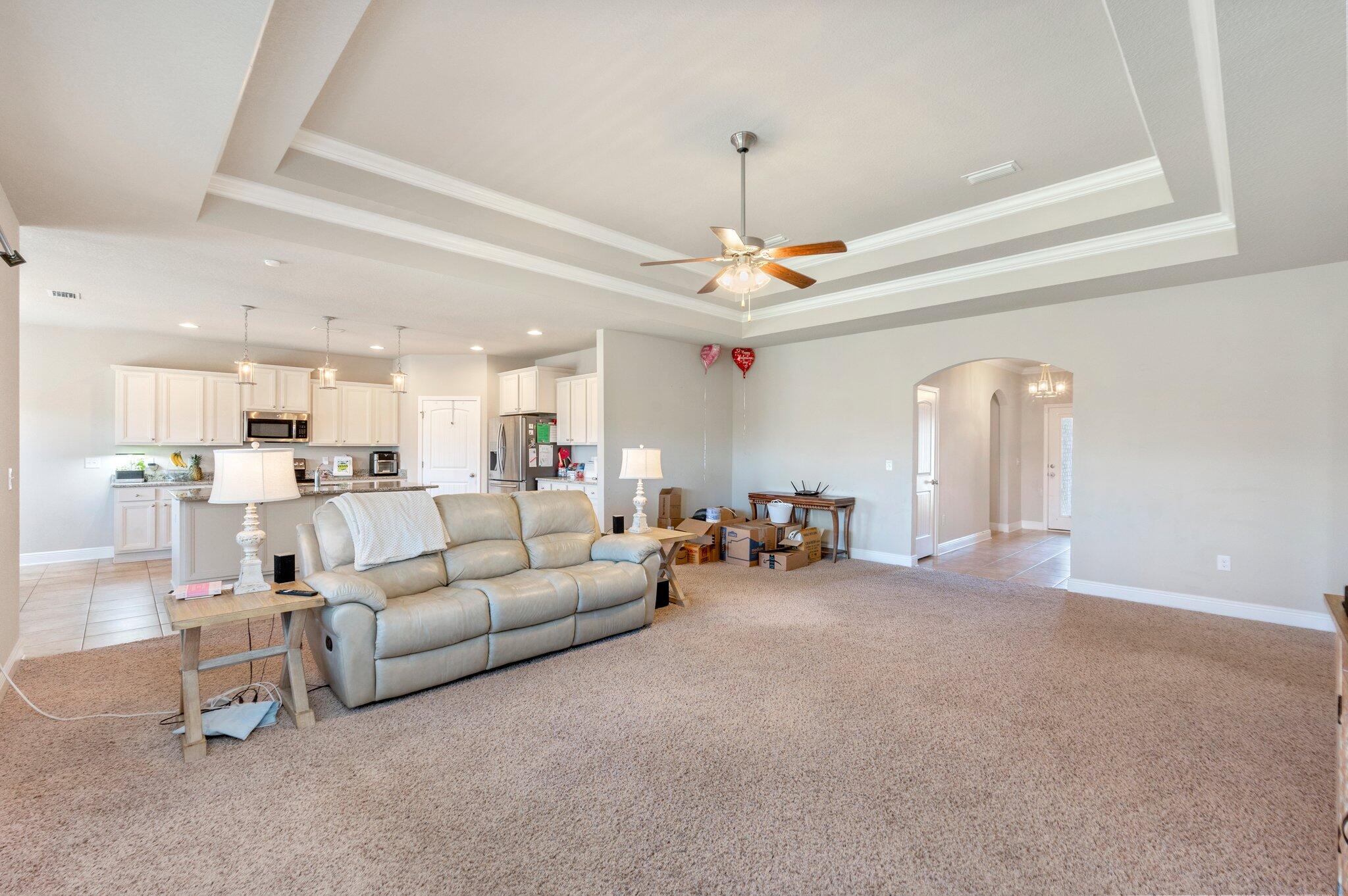 523 Gadwell Street Crestview, FL 32539 - Photo 30 of 30 a living room with furniture and a chandelier