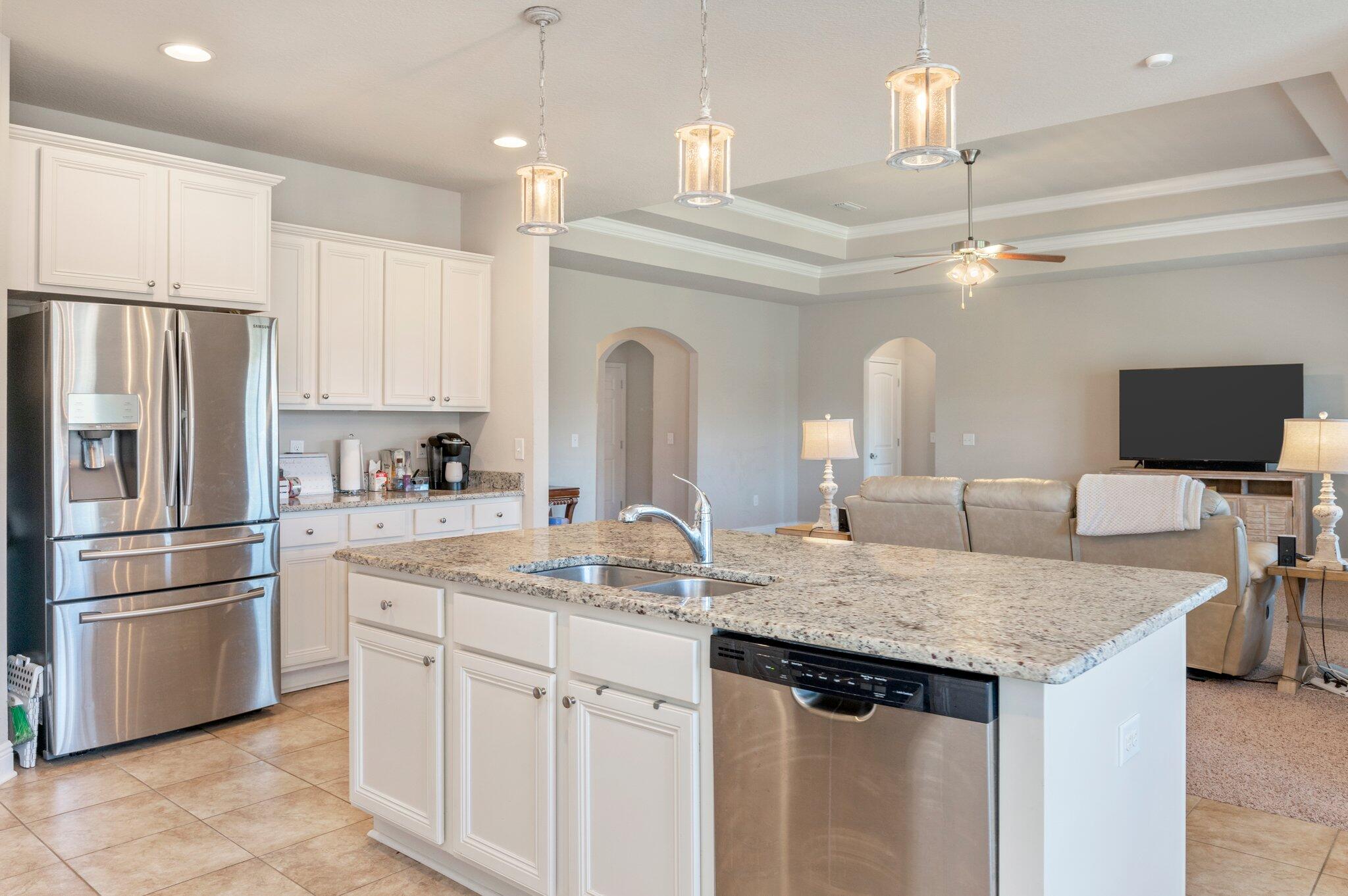 523 Gadwell Street Crestview, FL 32539 - Photo 8 of 30 a kitchen with stainless steel appliances granite countertop a sink refrigerator and cabinets