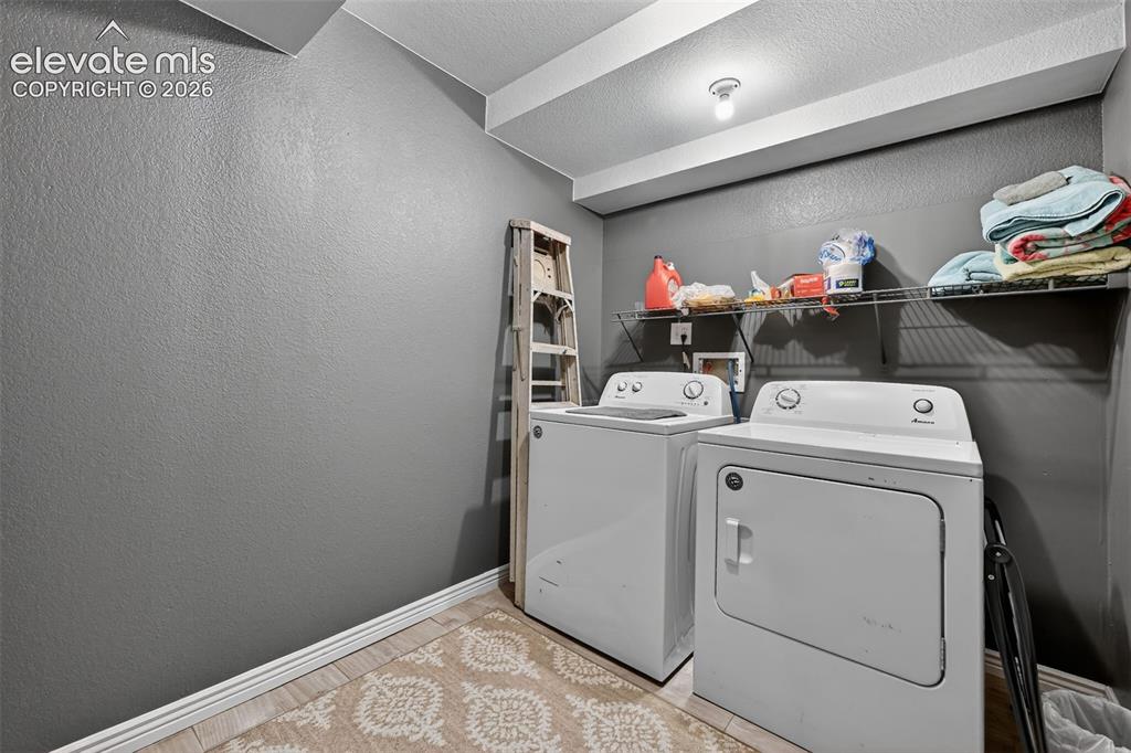 2141 Legacy Ridge View, Unit 109 Colorado Springs, CO 80910 - Photo 20 of 23 a room with storage and utility