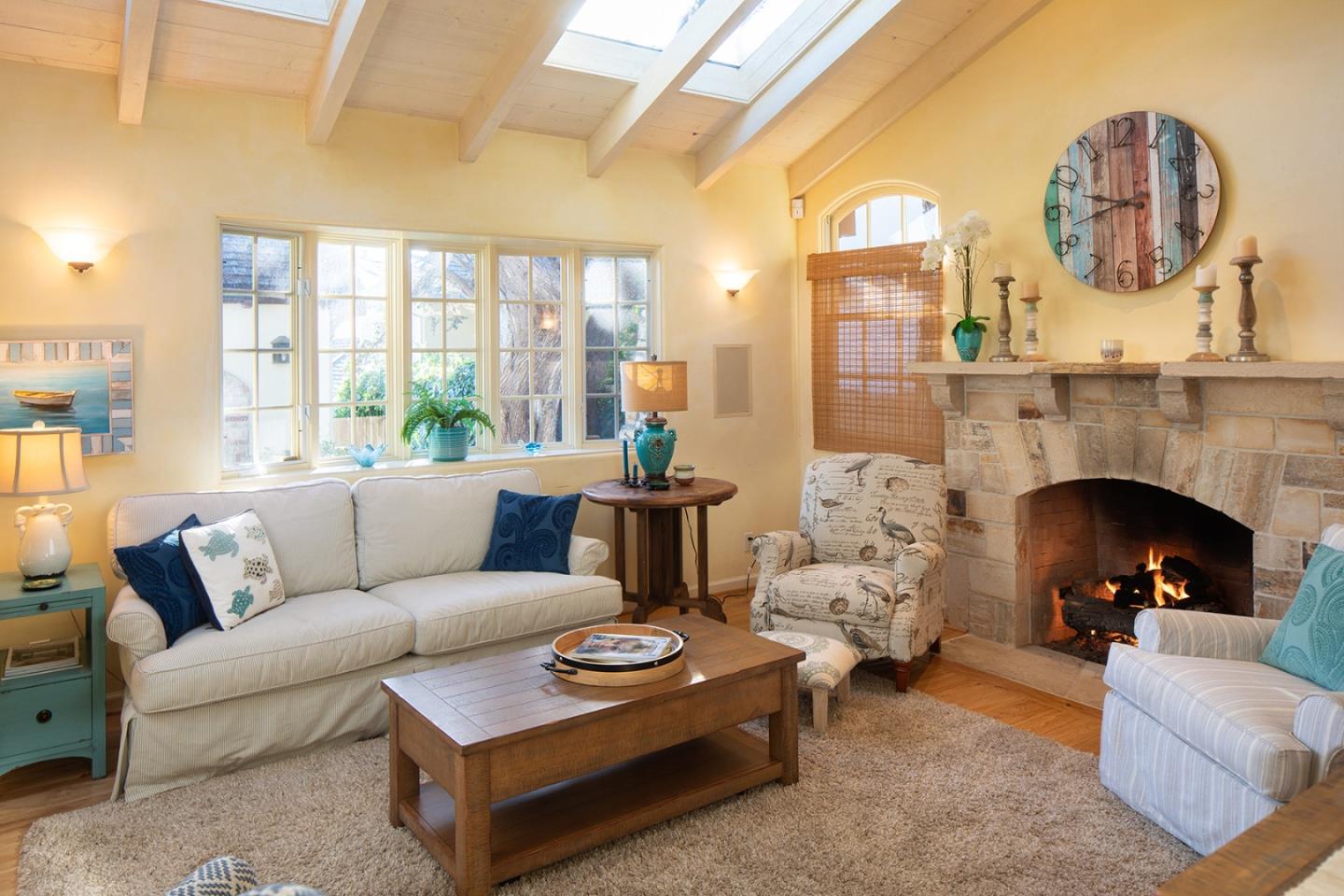 26335 Rio Avenue Carmel, CA 93923 - Photo 3 of 13 a living room with furniture fireplace and a large window