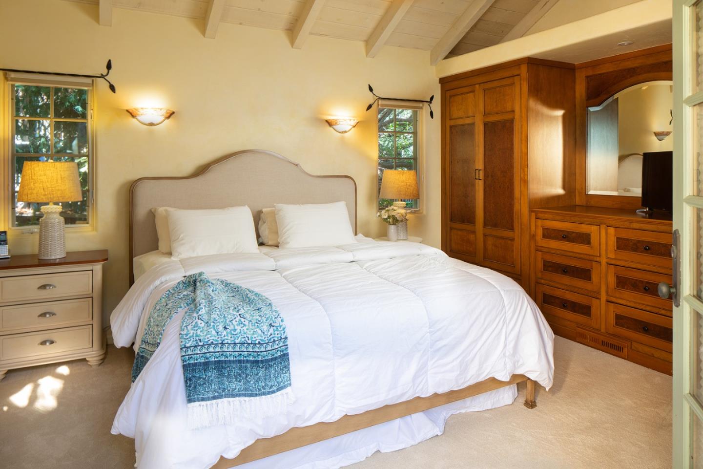 26335 Rio Avenue Carmel, CA 93923 - Photo 7 of 13 a bedroom with a bed and a dresser