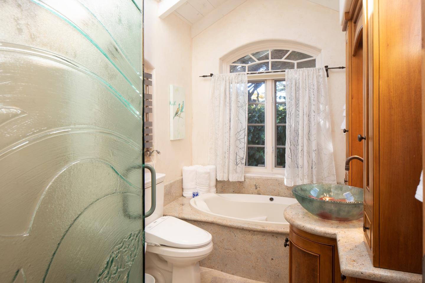 26335 Rio Avenue Carmel, CA 93923 - Photo 8 of 13 a bathroom with a sink a toilet and a bathtub