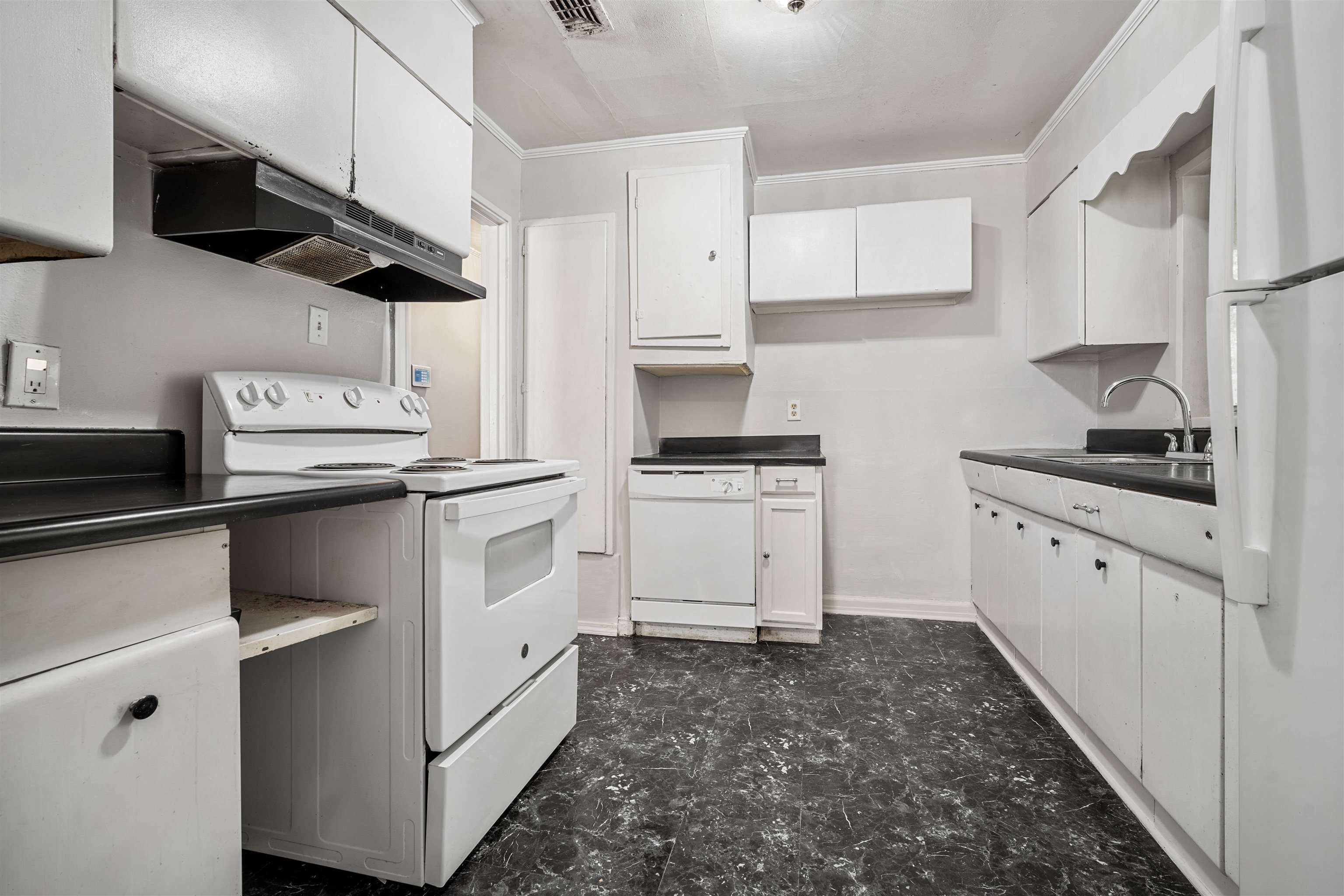 3014 Farcott Street Mobile, AL 36606 - Photo 7 of 26 Kitchen featuring white appliances, white cabinetry, dark countertops, and ornamental molding