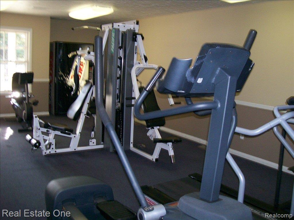 409 West Highland Road Howell, MI 48843 - Photo 12 of 17 exercise room 1