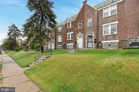 a view of a building with a yard